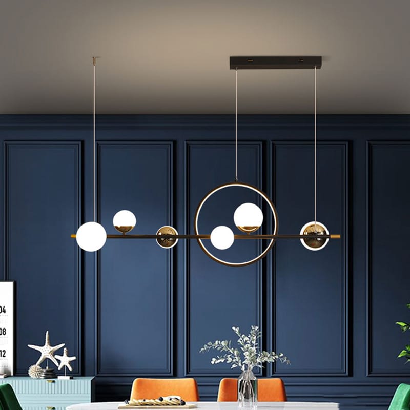 Como escolher o pendente ideal para a sala de jantar? Conheça diferentes modelos e estilos para compor sua mesa. 77 Lustre retangular bolas vidro Miresa